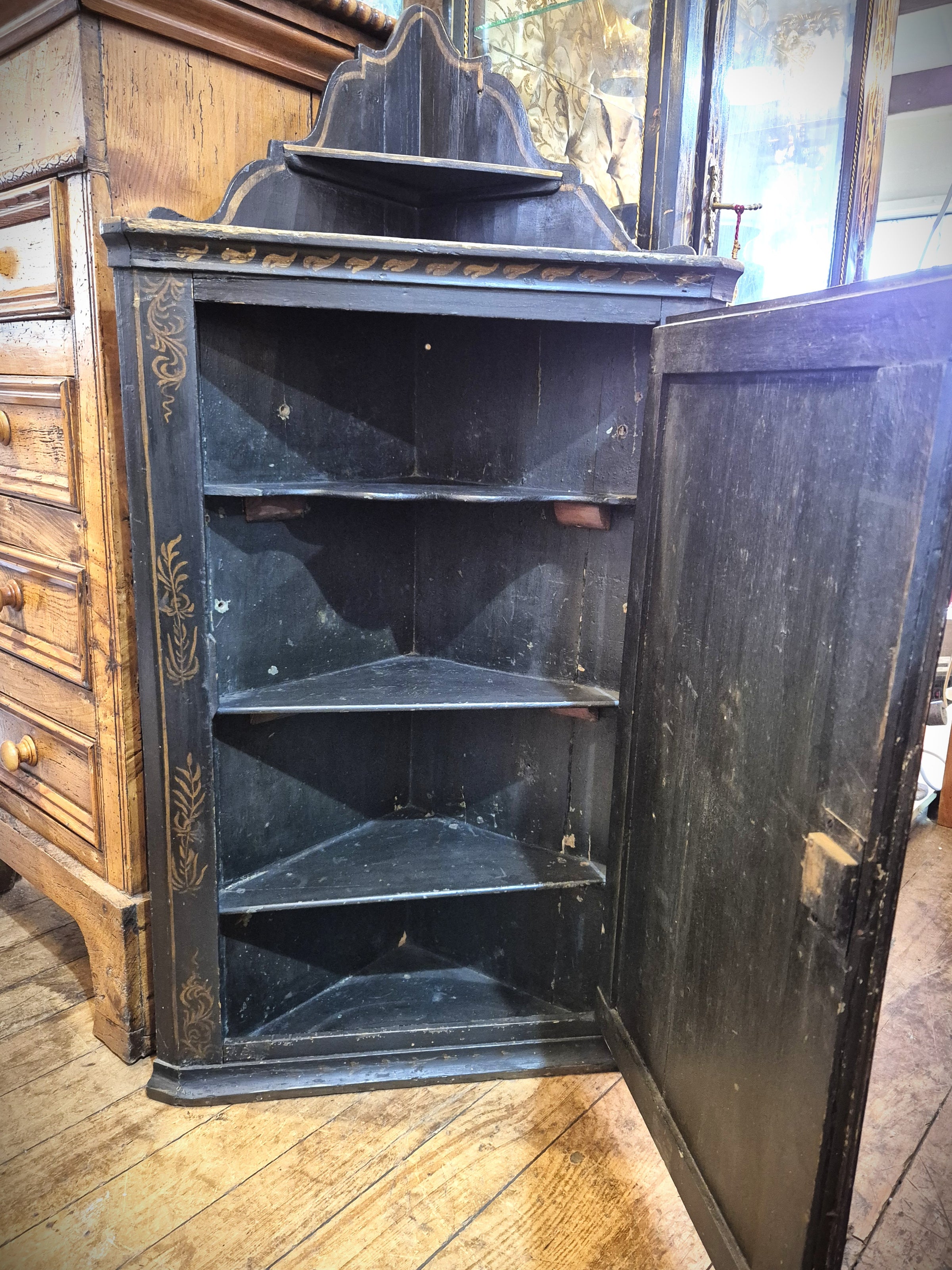 Antique Chinese Corner Cabinet with door open showing shelving inside.