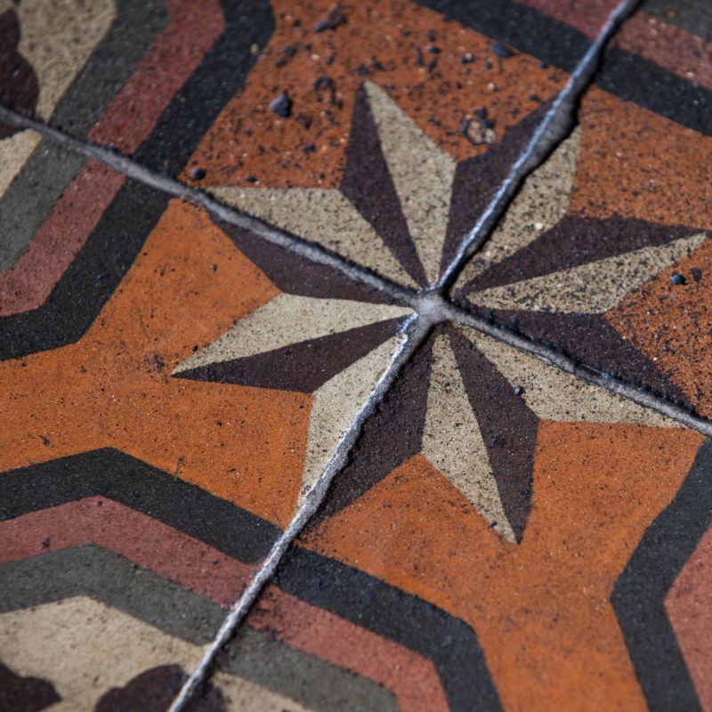 French tiles.  Photo of antique French tiles with a star pattern.