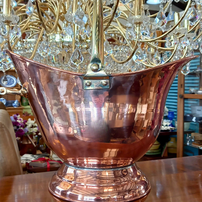 Copper and brass.  Photo of a Copper coal bucket with brass handle.
