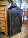 Antique Chinese black Corner Cabinet featuring painted birds and floral designs in gold. 
