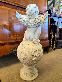 Vintage Cherub Garden Statue showing the back with the wings open.