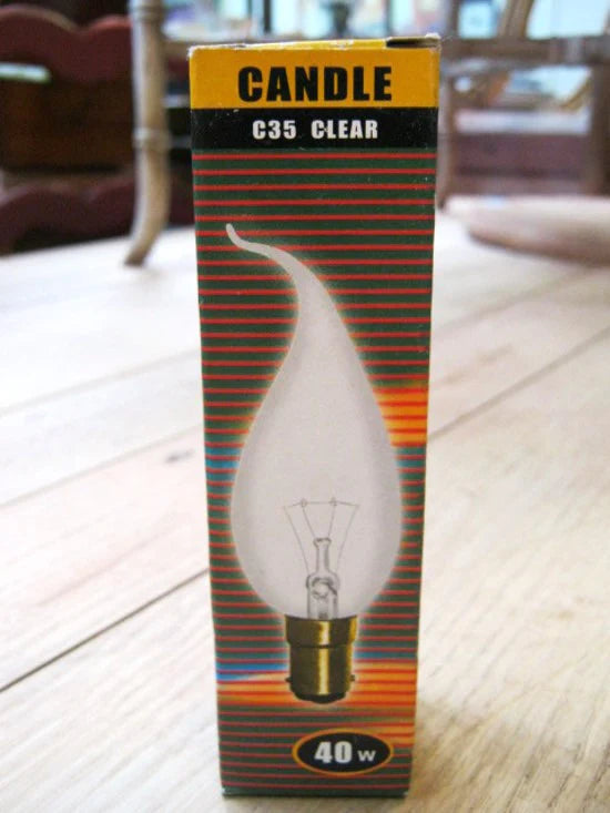 Photo shows 40W clear candle tip light bulb