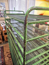 A vintage green metal english bakers trolley rack. Photo shows the vintage patina. 