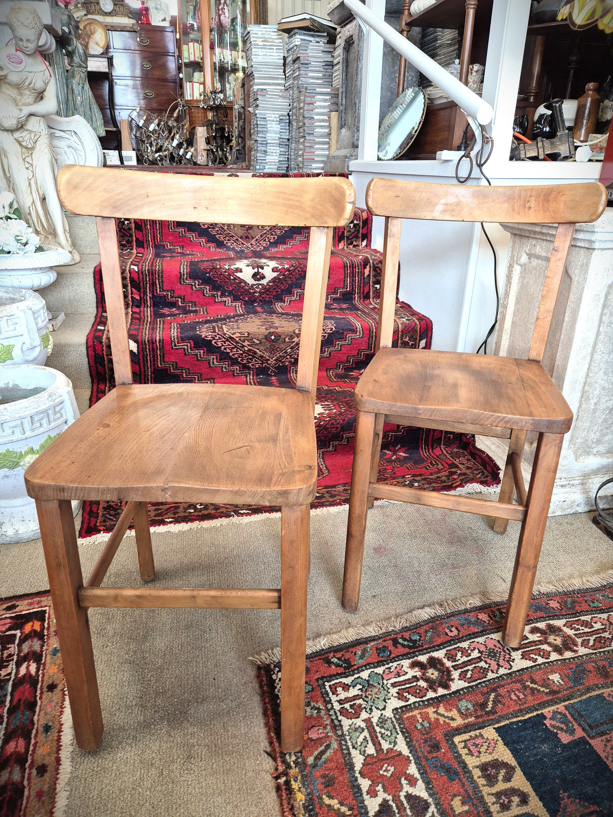 Two wooden childrens school chairs circa 1910