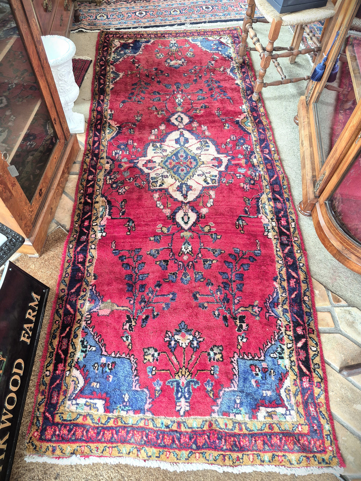Persian hallway rug in reds, blues and cream