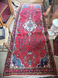 Persian hallway rug in reds, blues and cream