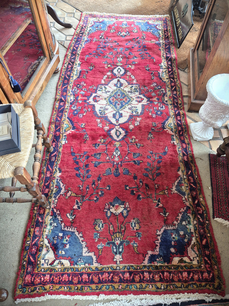 Persian hallway rug in reds, blues and cream