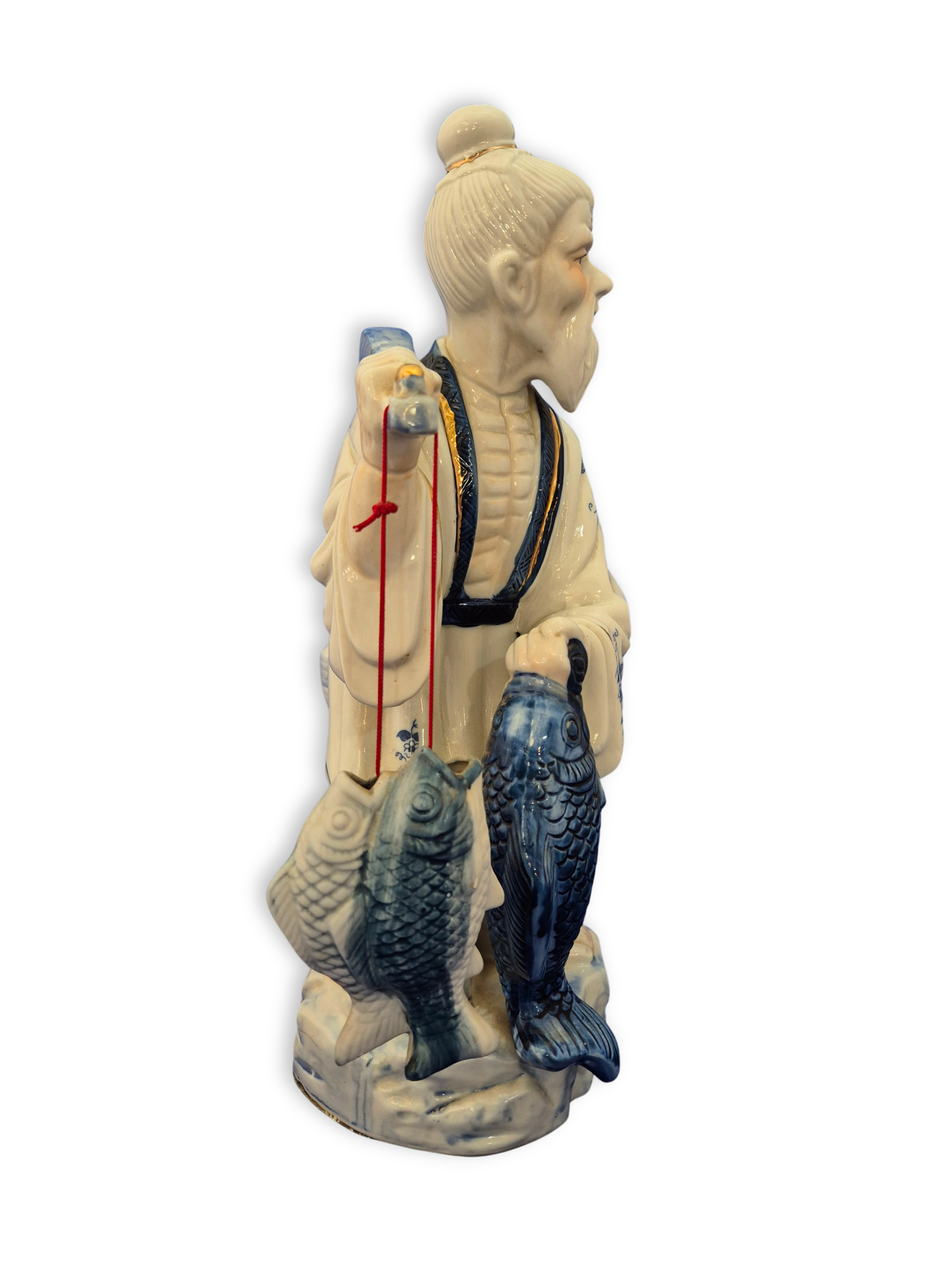 Chinese fisherman figurine showing the side view.