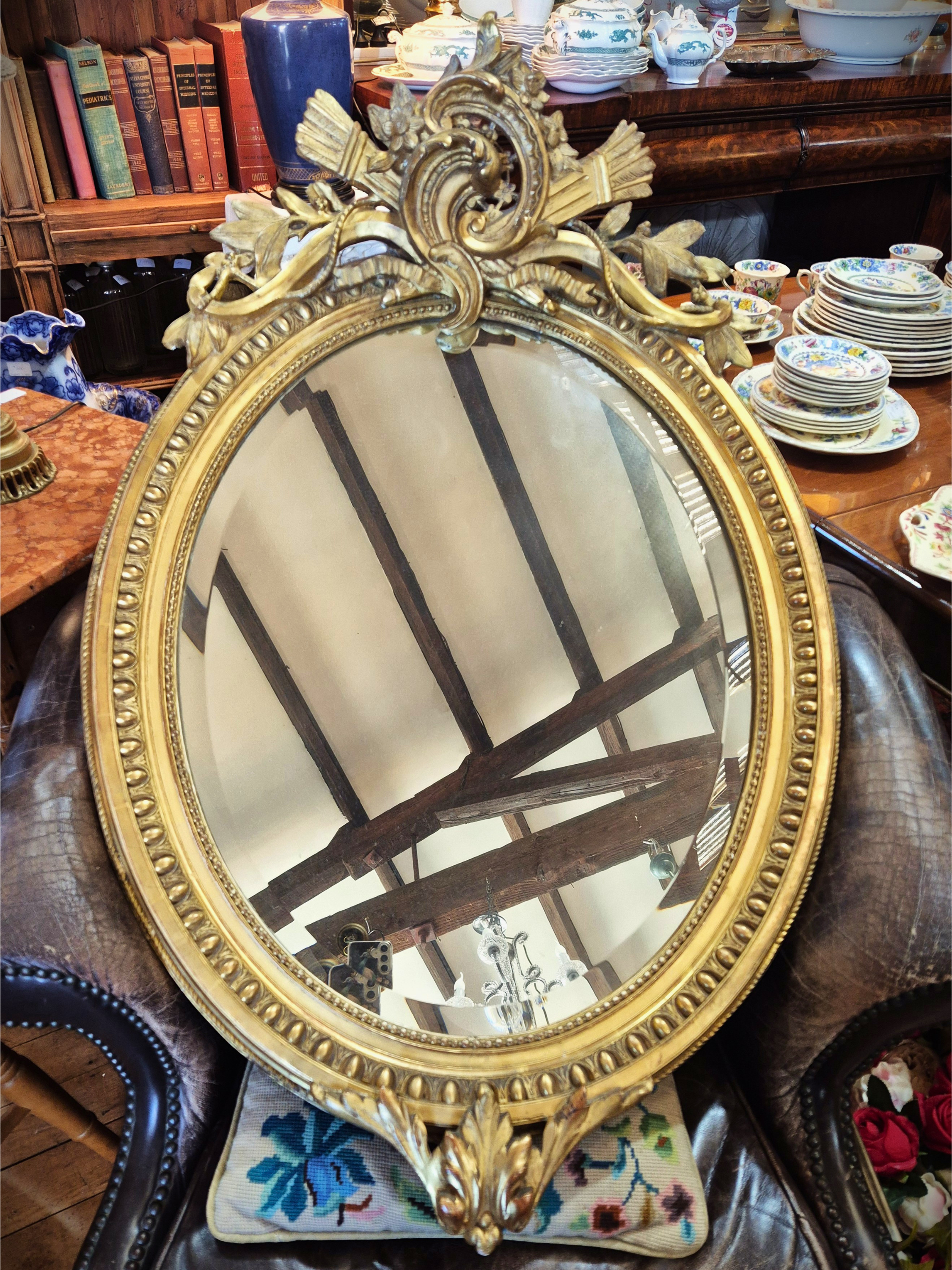Rococo style mirror with gilt frame and beveled glass